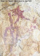 Pinturas rupestres del Abrigo de las Palomas. Antropomorfo en forma de tridente invertido y un sol a su derecha