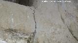 Ermita de San Torcuato. Grabados bajo la hornacina de la puerta de la iglesia primitiva