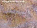 Pinturas rupestres de la Cueva del Engarbo I. Grupo II. Panel VII. Restos de otro toro que est entre el antropomorfo agachado de la danza y el toro que va a ser cazado por el arquero