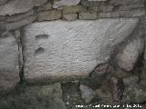 Cstulo. Necrpolis de la Puerta Norte. Inscripcin reaprovechada en el mausoleo romano. Pertenece a un varn con oficio de mercader