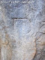 Petroglifos rupestres de El Toril. Figura formada por un ngulo y un semicrculo