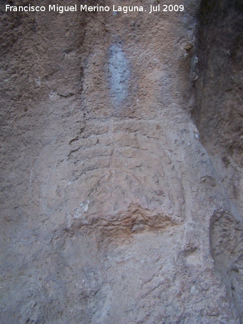 Petroglifos rupestres de El Toril - Petroglifos rupestres de El Toril. Petroglifo en forma de raspa