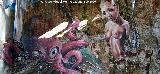 Grafiti Mujer y el Pulpo de la Cruz. 