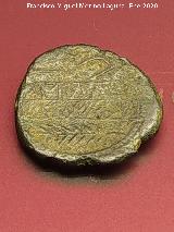 Obulco. Moneda Unidad de Obulco. Reverso arado, yugo y espiga. Museo Arqueológico Provincial de Jaén
