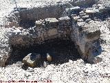 Cástulo. Viviendas. Piedra reutilizada