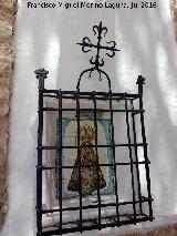 Santuario de Tíscar. Reja de rosetas y cepillo