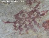 Pinturas rupestres de la Cueva de la Graja-Grupo VIII. En el centro de la escena un dolo con dos ojos y lneas en zig-zag debajo de estos
