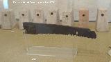 Cstulo. Pesas de telar de cermica y sierra de hierro. Siglos I-II d.C. Museo Arqueolgico de Linares