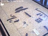 Cstulo. Asas de escudo, punta de lanza, fbula y fichas. Museo Arqueolgico de Linares