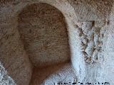 Casa Cueva Tallada del Tajo del Hacha. Hornacina con relieves