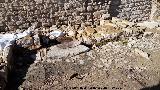 Muralla de Sabiote. Vivienda intramuros con puerta de piedras de molino reutilizadas