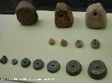 Oppidum de Giribaile. Pesas de telar, fusayolas y ponderales siglos II aC. I dC.  Museo Provincial
