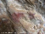 Pinturas rupestres de la Cueva de los Herreros Grupo XI. Dos cnidos inferiores centrales muy desvados