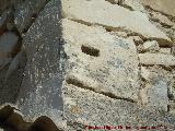 Yacimiento romano de Torrealczar. Sillar romano reutilizado en la Torre del Alczar