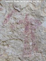 Pinturas rupestres de la Caada de la Corcuela. Antropomorfo bajo derecho capturando a las cabras